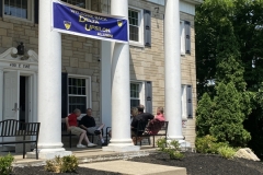 23-Alumni-Weekend-Board-Members-on-Porch